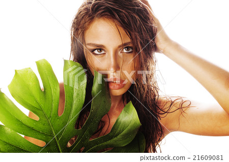 young brunette elegant woman with green leaf 21609081