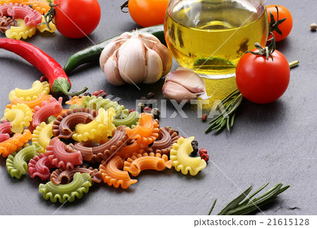 pasta of different colors, tomatoes, garlic pasta of different colors, tomatoes, garlic 21615128
