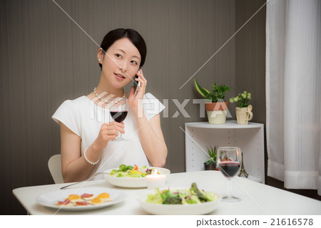 A lady while eating A lady while eating 21616578