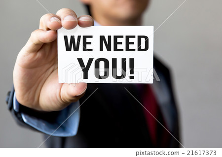 Young man in business suit showing WE NEED YOU Young man in business suit showing WE NEED YOU 21617373