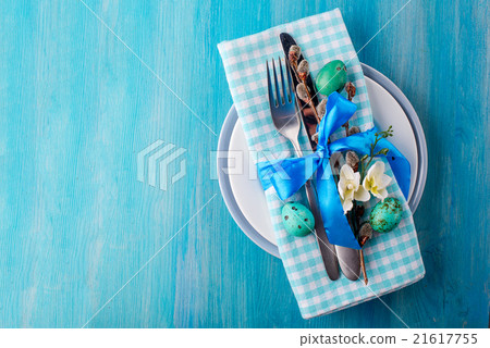 Easter table setting with eggs and cutlery. Easter table setting with eggs and cutlery. 21617755