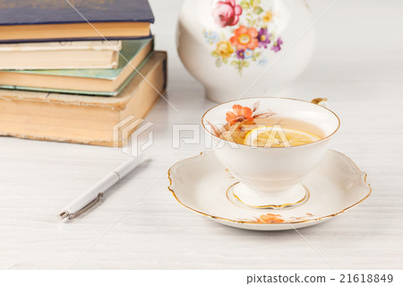 Tea with lemon and books on the table Tea with lemon and books on the table 21618849