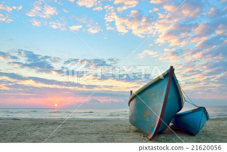 sunrise over an  wooden fishing boats 21620056