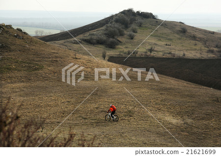 Man cyclist with backpack riding the bicycle 21621699