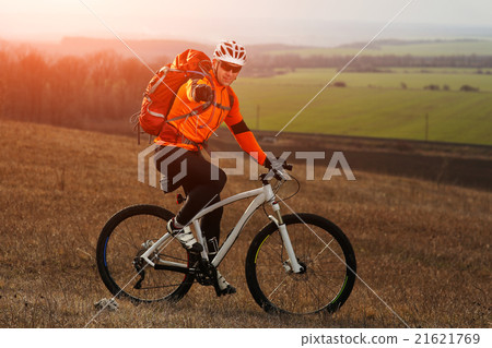 Man cyclist with backpack riding the bicycle Man cyclist with backpack riding the bicycle 21621769