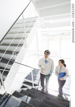Men and women in work clothes Men and women in work clothes 21622303