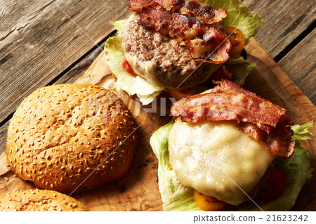 Home made cheeseburgers on wooden table Home made cheeseburgers on wooden table 21623242