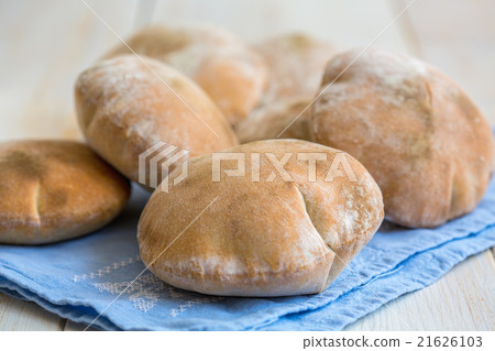 Homemade pita on blue linen napkin. Homemade pita on blue linen napkin. 21626103