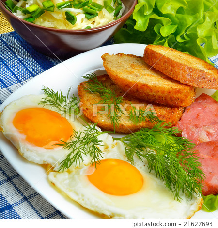 English breakfast - toast, egg, bacon, vegetables 21627693