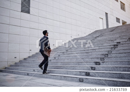 Businessman on stairs 21633789