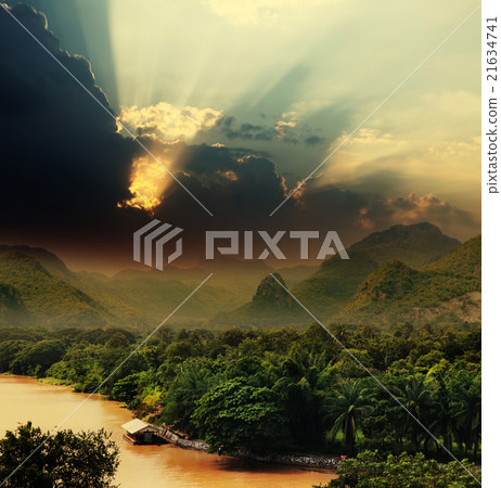 Sunset with rays over river 21634741