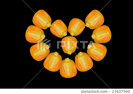 Corn in heart shape on black background Corn in heart shape on black background 21637560