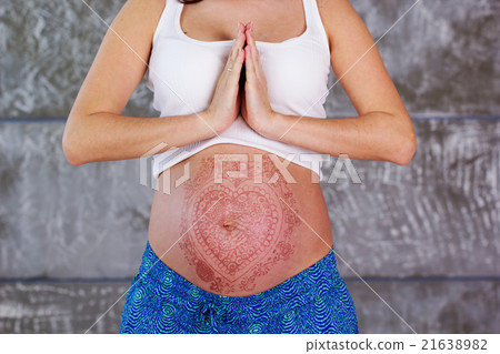 Belly of pregnant girl  with mehendi tattoo 21638982