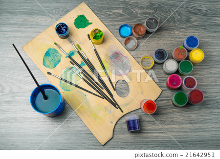 colored pencils paint brush against dark table colored pencils paint brush against dark table 21642951