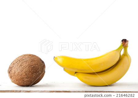 Coconut and bananas on the white background Coconut and bananas on the white background 21646282
