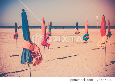 The famous colorful parasols on Deauville beach 21646490