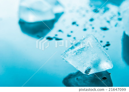 Ice cube in the blue background Ice cube in the blue background 21647099