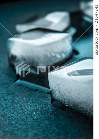 Ice cubes on the dark stone table vertical Ice cubes on the dark stone table vertical 21647243