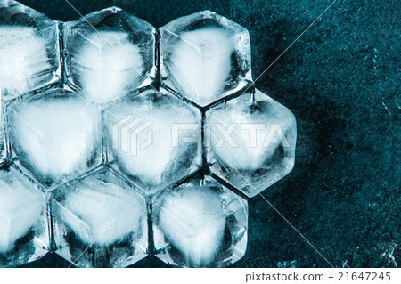 Honeycomb ice cubes on the dark stone table Honeycomb ice cubes on the dark stone table 21647245