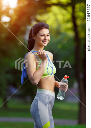 Fitness woman with a skipping rope 21647867