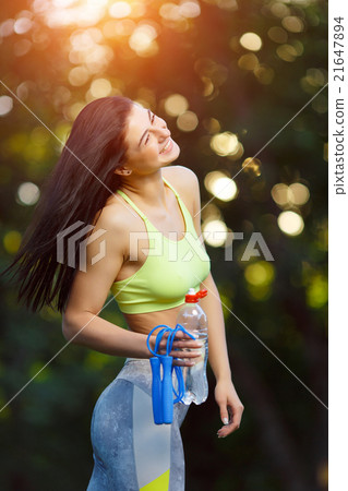 Fitness woman with a skipping rope 21647894