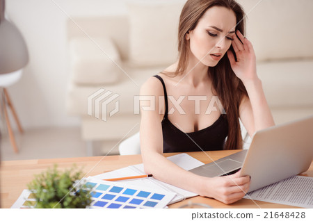 Busy girl working at the table Busy girl working at the table 21648428