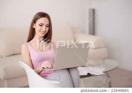 Content young girl using laptop 21648665