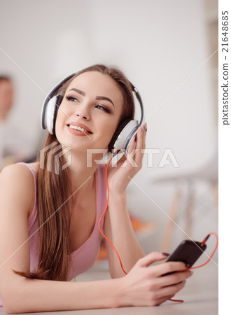 Cheerful girl listening to music Cheerful girl listening to music 21648685