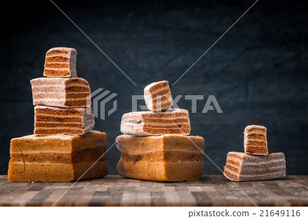 Pyramids of pastila pieces on the wooden table Pyramids of pastila pieces on the wooden table 21649116