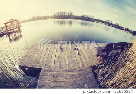 Vintage toned fisheye lens picture of fishing rods Vintage toned fisheye lens picture of fishing rods 21650554