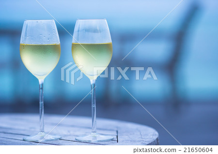 Two glasses of tasty white wine at sunset  21650604