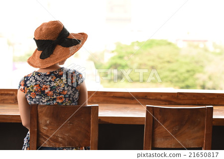 A woman looking out 21650817