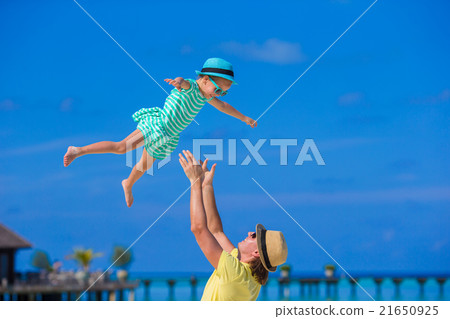 Happy dad having fun with little daughter on Happy dad having fun with little daughter on 21650925