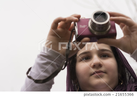 Young Little Girl Is Taking Photograph by camera Young Little Girl Is Taking Photograph by camera 21655366