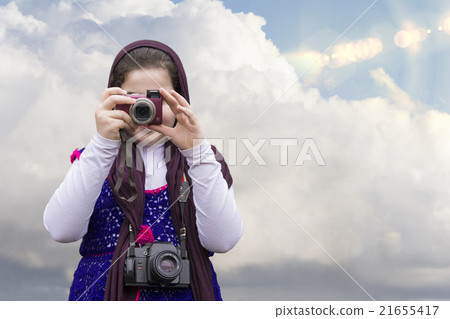 Young Little Girl Is Taking Photograph by camera Young Little Girl Is Taking Photograph by camera 21655417