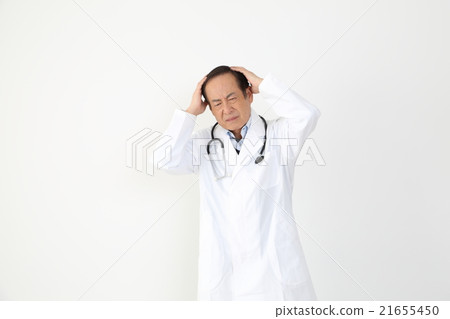 A doctor holding a head 21655450