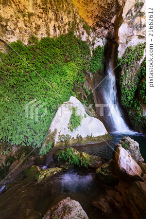 Natural grot with waterfall Natural grot with waterfall 21662612