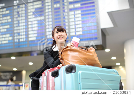 Business woman carrying lots of luggage 21663924
