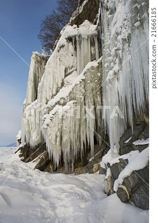 Huge icicles on rocks. Huge icicles on rocks. 21666185