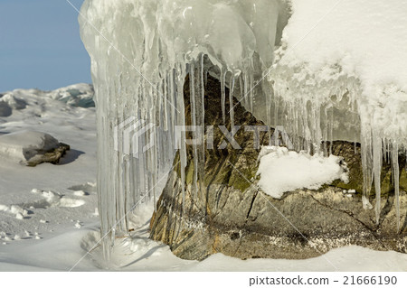 Beautiful icicles on rocks.  21666190