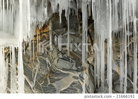 Beautiful icicles on rocks.  21666191