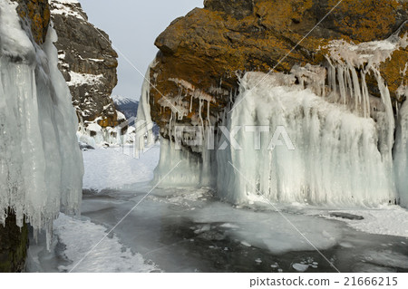 Beautiful icicles on rocks. Beautiful icicles on rocks. 21666215