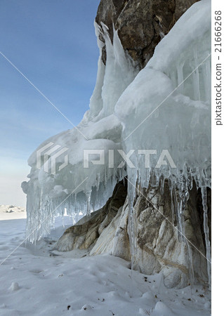 Huge icicles on rocks. Huge icicles on rocks. 21666268
