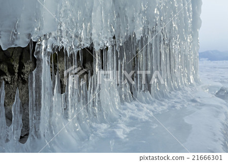 Huge icicles on rocks. Huge icicles on rocks. 21666301