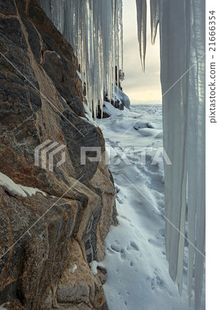 Huge icicles on rocks. Huge icicles on rocks. 21666354