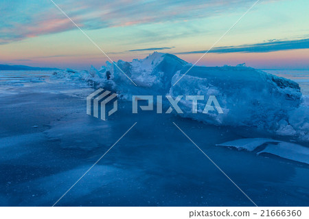 Huge blocks of ice at sunset sky background. Huge blocks of ice at sunset sky background. 21666360