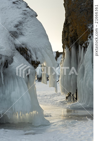 Beautiful icicles on rocks. Beautiful icicles on rocks. 21666361