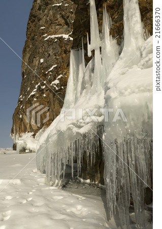 Huge icicles on rocks. Huge icicles on rocks. 21666370