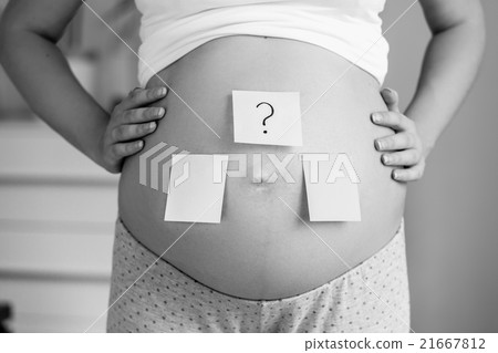 conceptual photo of pregnant woman making choice conceptual photo of pregnant woman making choice 21667812
