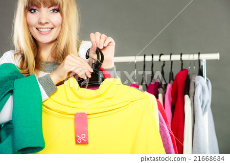 Woman holding discount label. Sale and retail. 21668684
